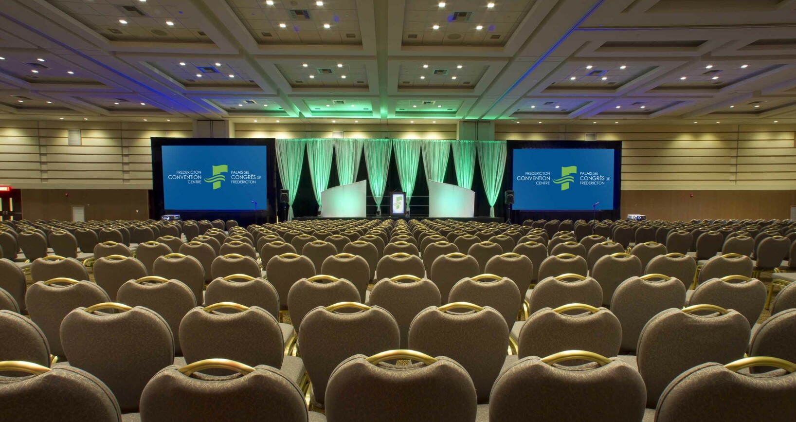 Ballroom Theatre 1000 seats w FCC logos on screen